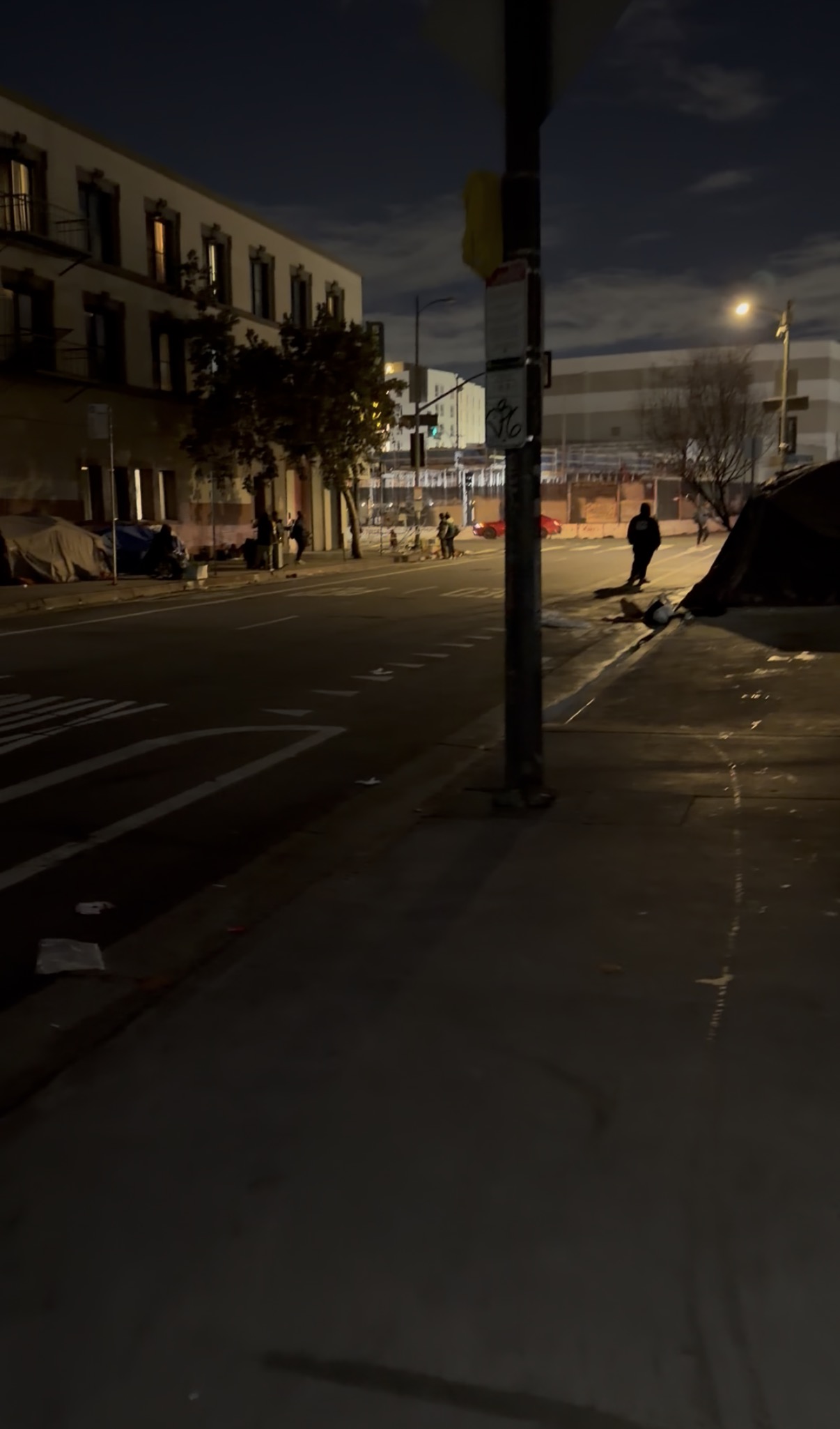 Skid Row at night, a single street away from Downtown's skyscrapers
